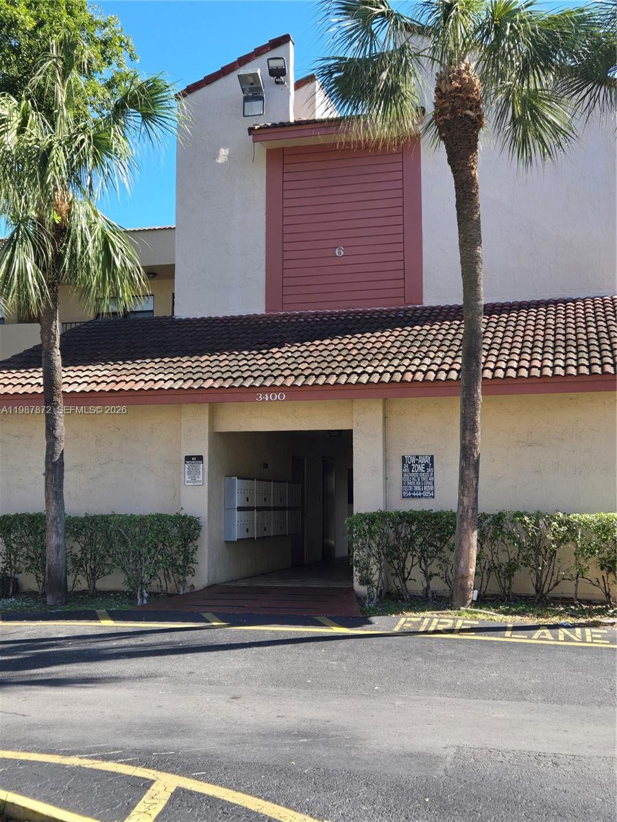 3400 Foxcroft Road, Unit 209 Miramar, FL 33025 - Photo 2 of 19 front view of a house with a street