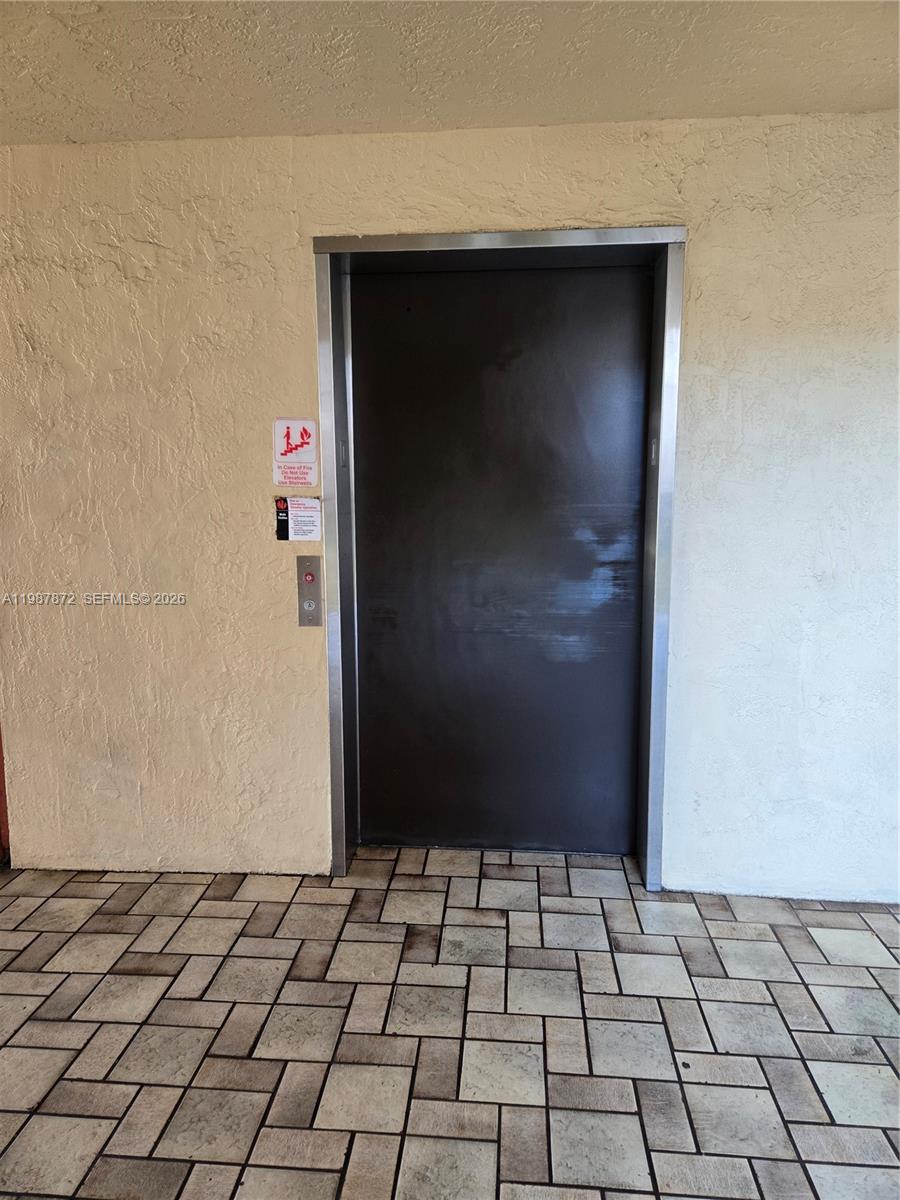 3400 Foxcroft Road, Unit 209 Miramar, FL 33025 - Photo 4 of 19 a view of a wooden door