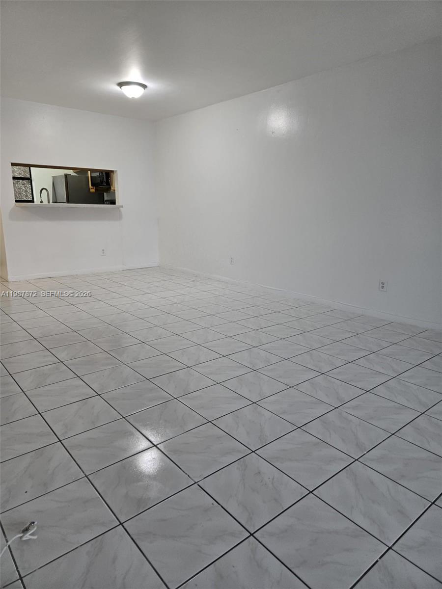 3400 Foxcroft Road, Unit 209 Miramar, FL 33025 - Photo 8 of 19 a view of a hallway