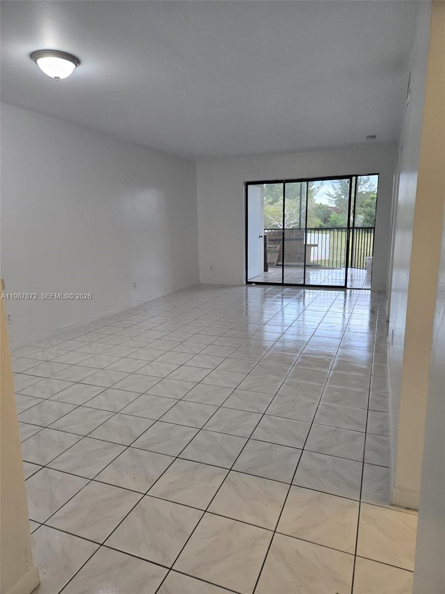 3400 Foxcroft Road, Unit 209 Miramar, FL 33025 - Photo 9 of 19 a view of an empty room and window
