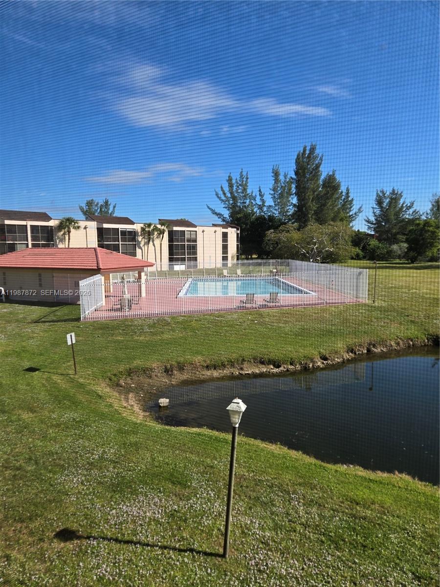 3400 Foxcroft Road, Unit 209 Miramar, FL 33025 - Photo 10 of 19 a view of a lake with a big yard