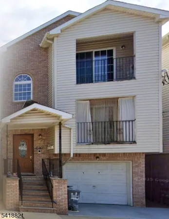 a front view of a house with a garage