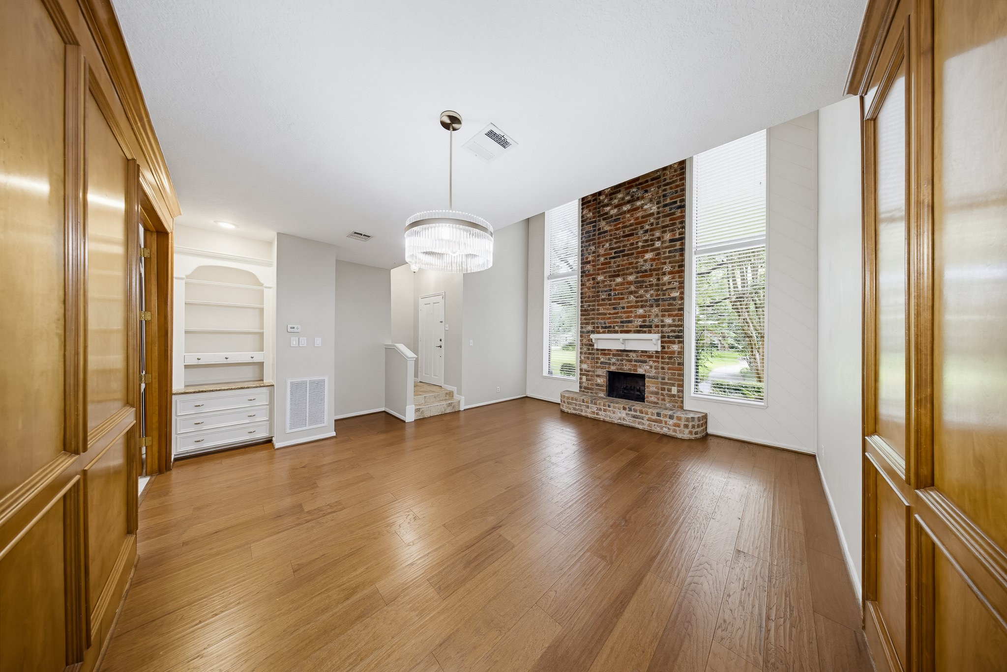 727 Bunker Hill Road, Unit 34 Houston, TX 77024 - Photo 13 of 38 The living room boasts long windows that invite the sunlight in