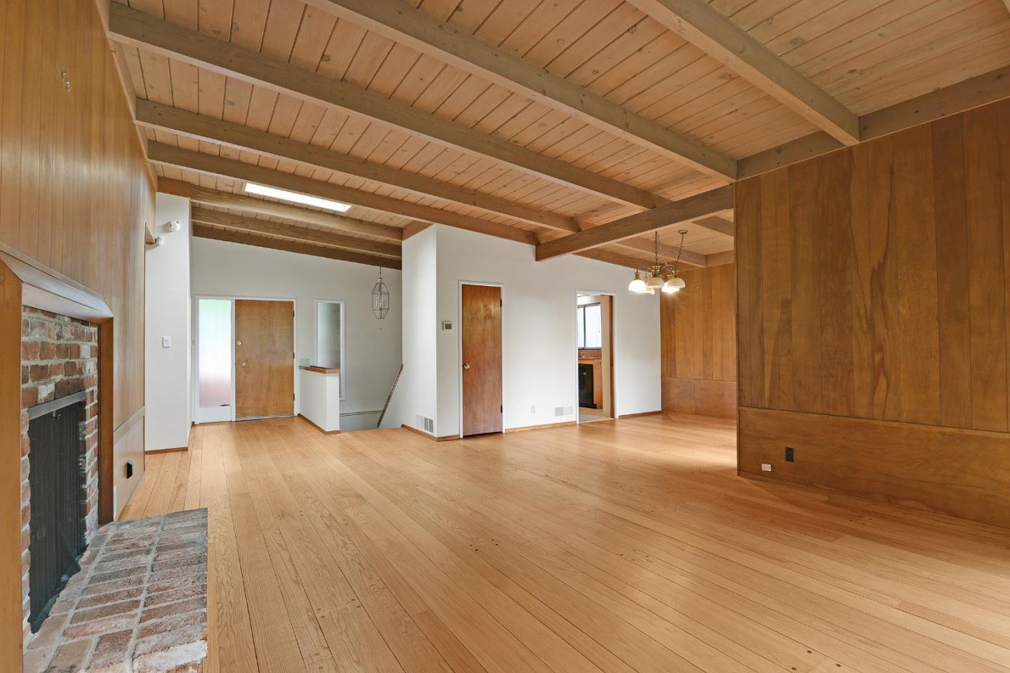 1434 Queens Road Berkeley, CA 94708 - Photo 8 of 32 a view of a livingroom with wooden floor and staircase