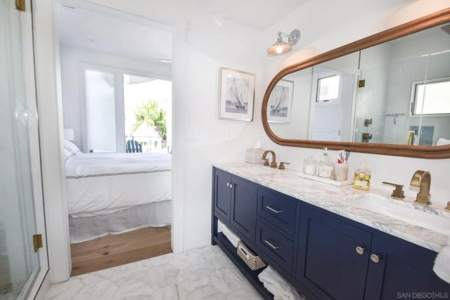 a bathroom with a double vanity sink and a mirror