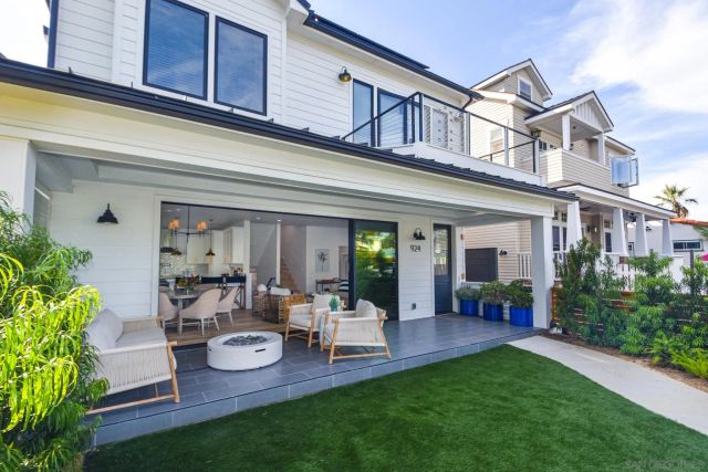 a view of a house with furniture and garden