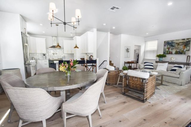 a living room with lots of furniture and a chandelier