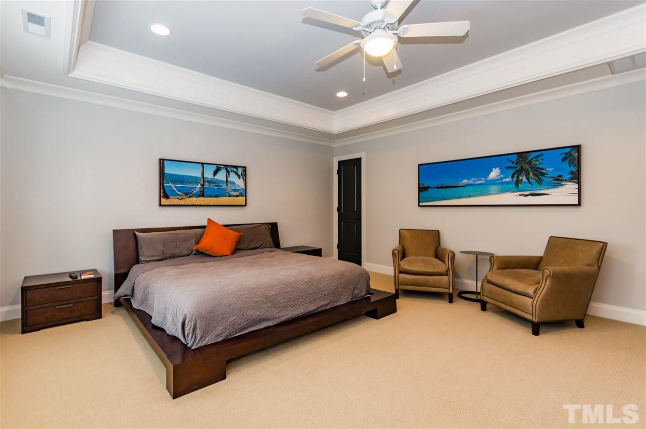 511 Mial Street Raleigh, NC 27608 - Photo 14 of 25 a bedroom with a bed and furniture