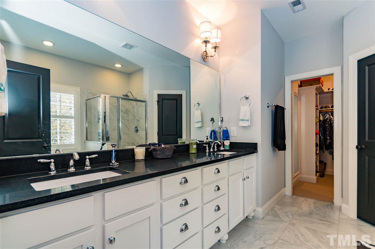 511 Mial Street Raleigh, NC 27608 - Photo 15 of 25 a bathroom with double sink and a mirror