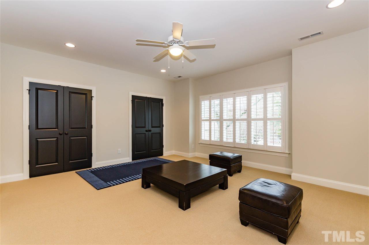 511 Mial Street Raleigh, NC 27608 - Photo 17 of 25 a living room with furniture window and a flat screen tv
