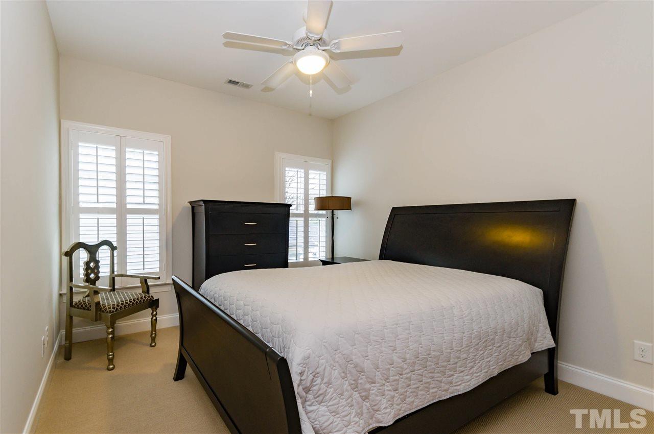 511 Mial Street Raleigh, NC 27608 - Photo 18 of 25 a bedroom with a bed and window