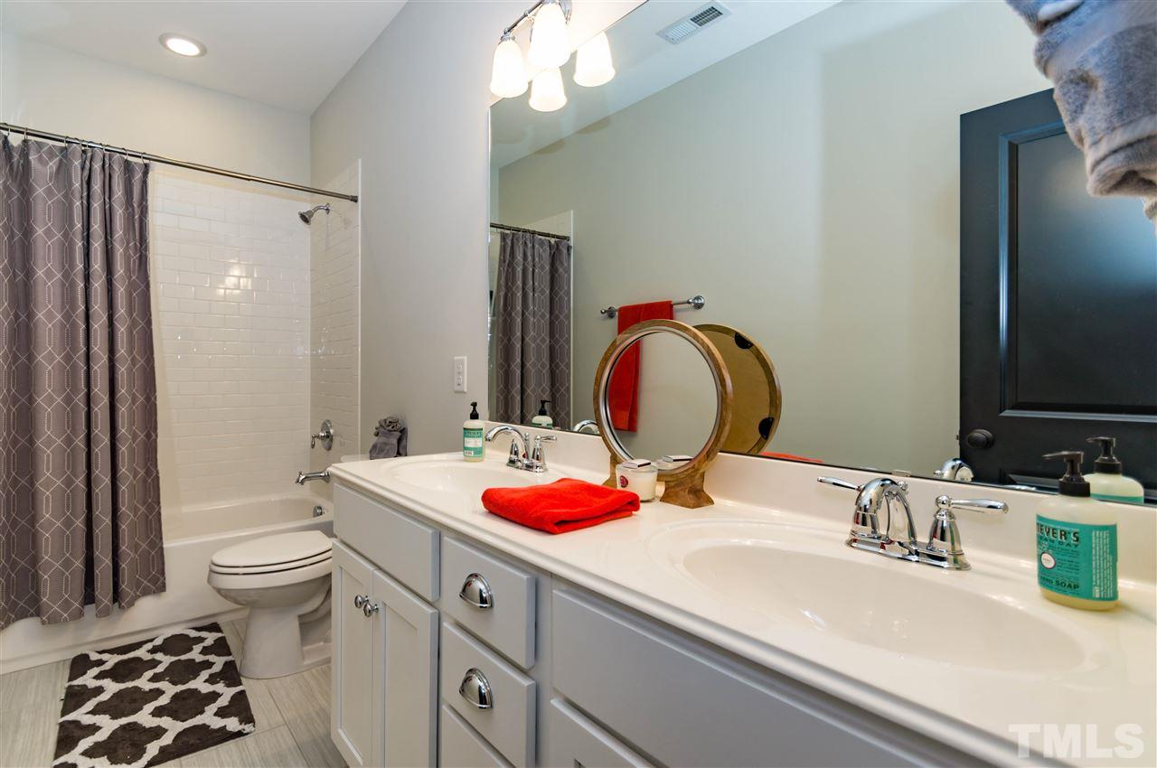 511 Mial Street Raleigh, NC 27608 - Photo 19 of 25 a bathroom with a sink and a mirror