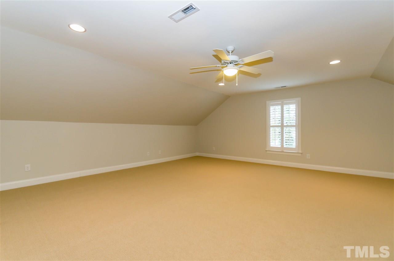 511 Mial Street Raleigh, NC 27608 - Photo 21 of 25 an empty room with a window and a ceiling fan