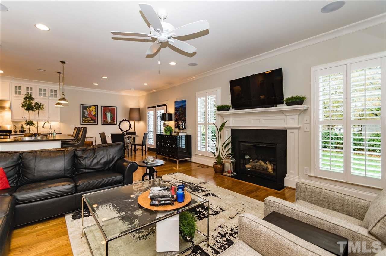 511 Mial Street Raleigh, NC 27608 - Photo 6 of 25 a living room with furniture fireplace and a flat screen tv