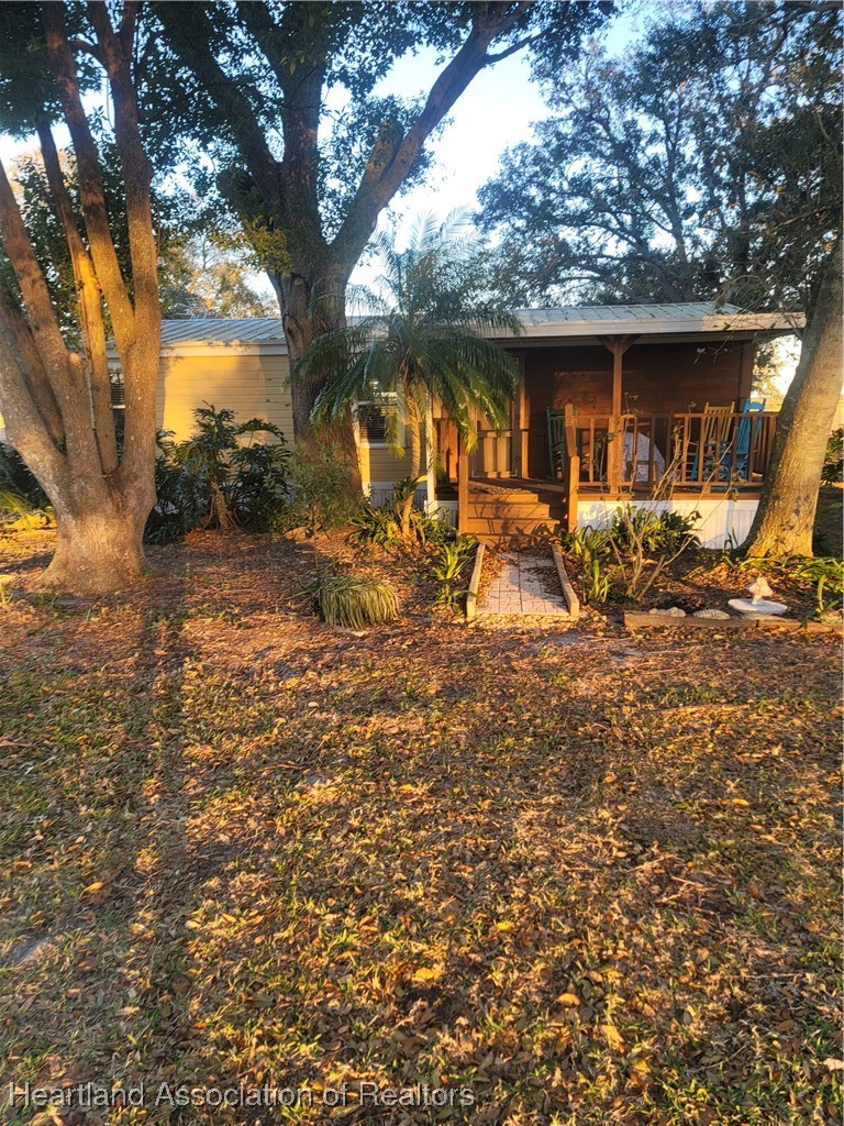 101 Bereah Road East Fort Meade, FL 33841 - Photo 6 of 7 a backyard of a house with seating space