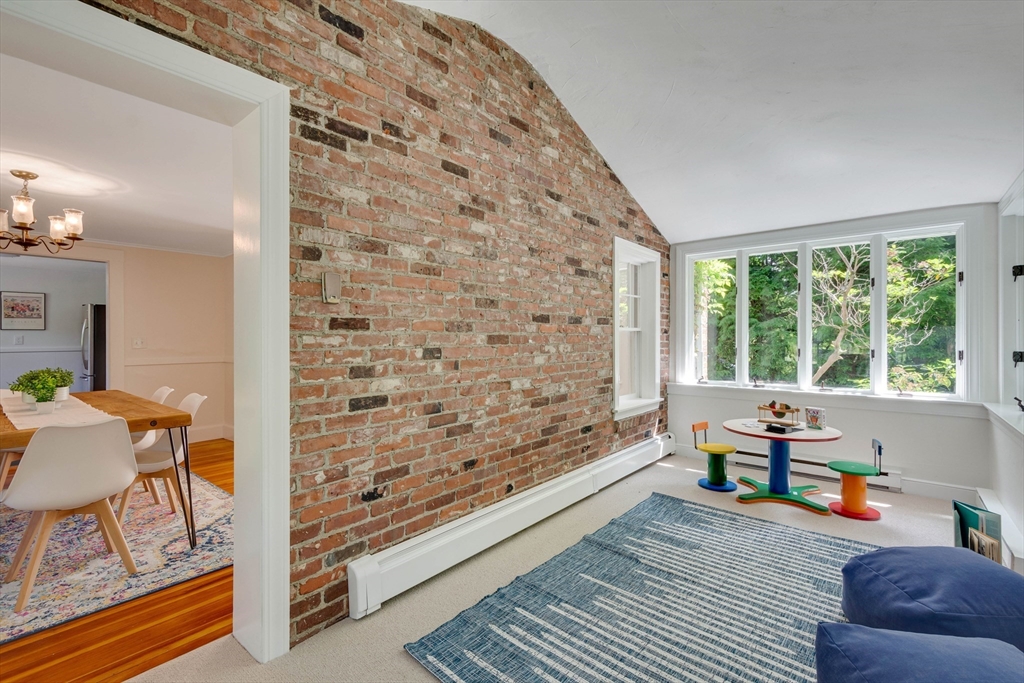 95 Tower Road Lincoln, MA 01773 - Photo 12 of 41 a living room with furniture and a large window