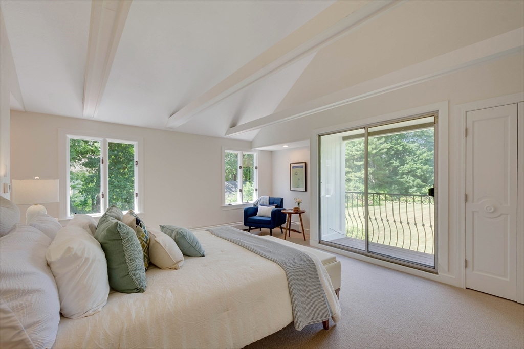 95 Tower Road Lincoln, MA 01773 - Photo 21 of 41 a bedroom with a bed and a large window