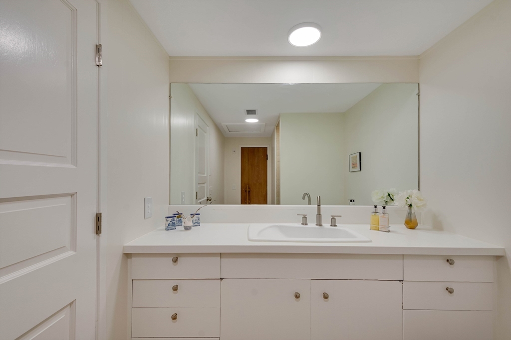95 Tower Road Lincoln, MA 01773 - Photo 25 of 41 a bathroom with double vanity sink and a mirror