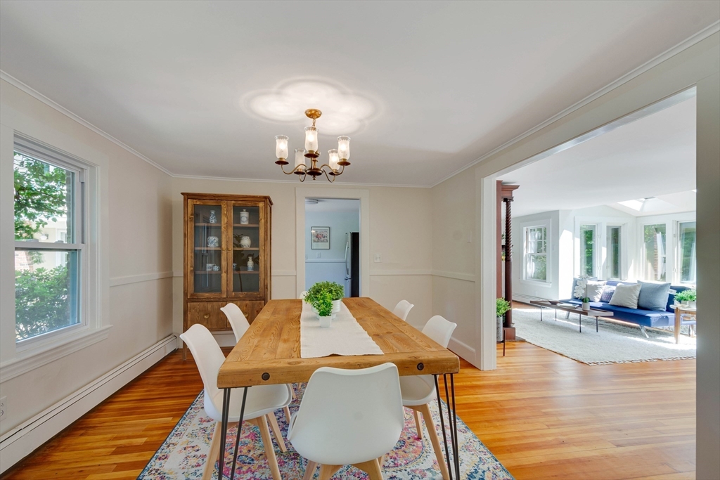 95 Tower Road Lincoln, MA 01773 - Photo 3 of 41 a view of a dining room with furniture wooden floor and chandelier