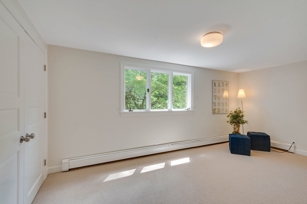 95 Tower Road Lincoln, MA 01773 - Photo 31 of 41 a view of an empty room with a window