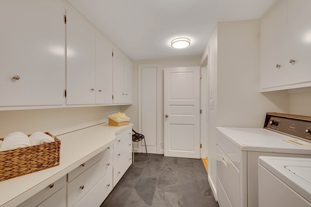 95 Tower Road Lincoln, MA 01773 - Photo 32 of 41 a kitchen with white cabinets and white appliances