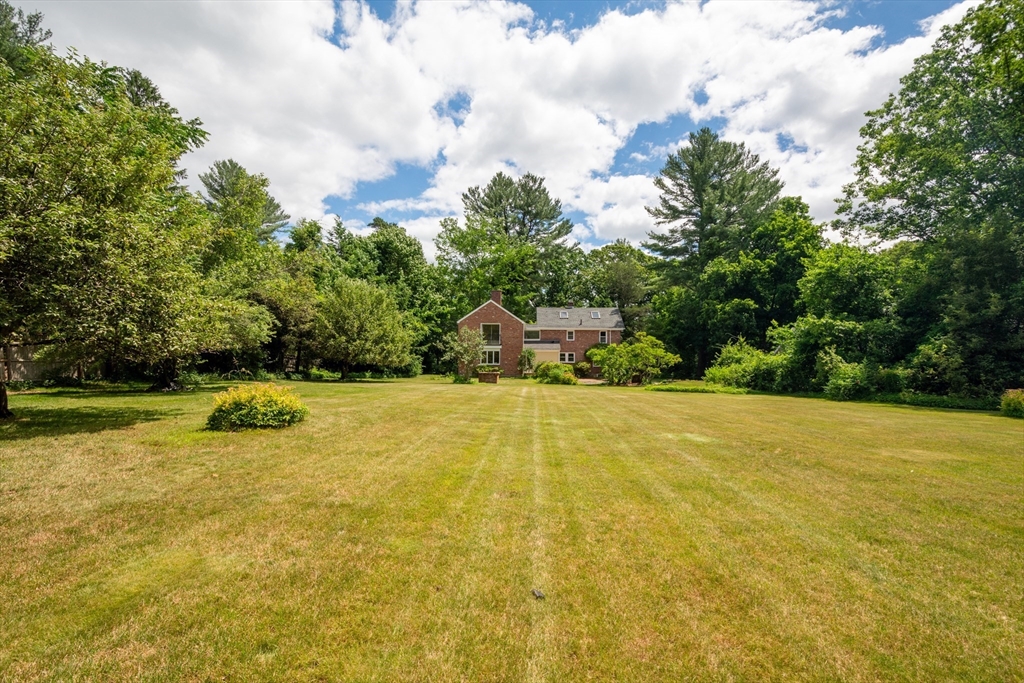 95 Tower Road Lincoln, MA 01773 - Photo 40 of 41 a view of a swimming pool and trees in the background