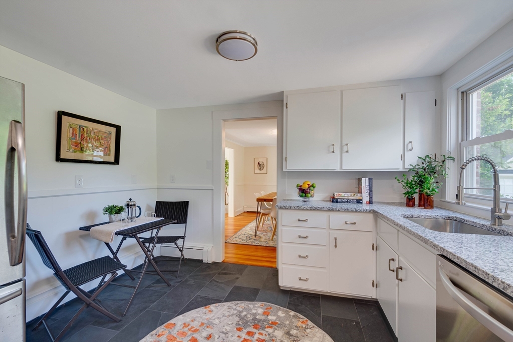 95 Tower Road Lincoln, MA 01773 - Photo 4 of 41 a kitchen with a cabinets and chair in it