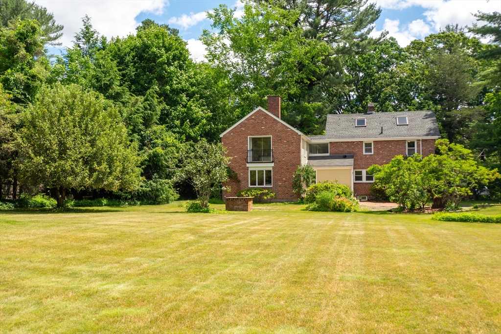 95 Tower Road Lincoln, MA 01773 - Photo 41 of 41 a front view of a house with a yard