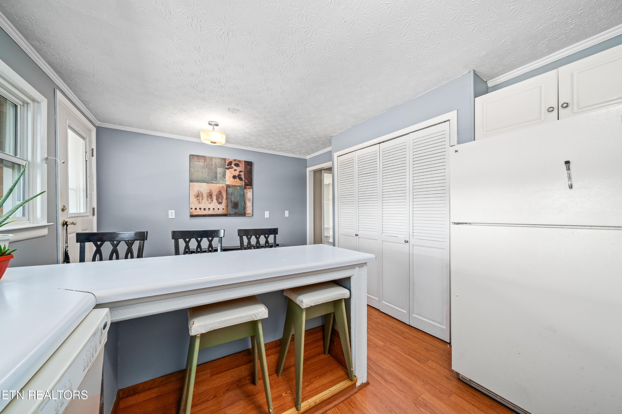 3323 Fisk Road Cookeville, TN 38506 - Photo 11 of 31 a view of a dining room with furniture and wooden floor