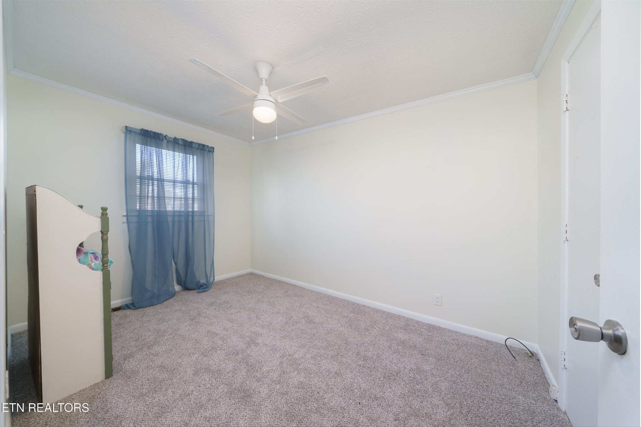 3323 Fisk Road Cookeville, TN 38506 - Photo 20 of 31 an empty room with a window and ceiling fan