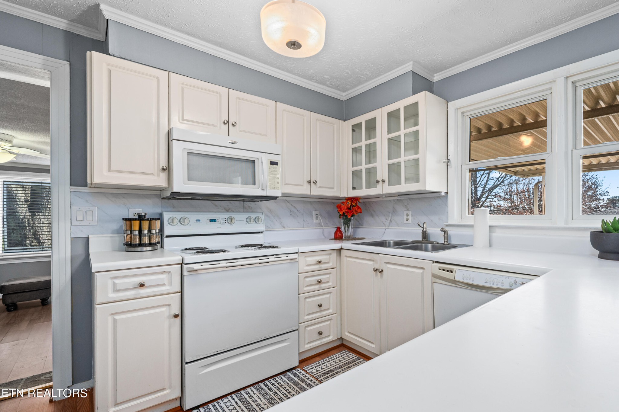 3323 Fisk Road Cookeville, TN 38506 - Photo 10 of 31 a kitchen with cabinets appliances a sink and a window