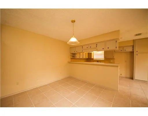 a view of a kitchen with wooden floor