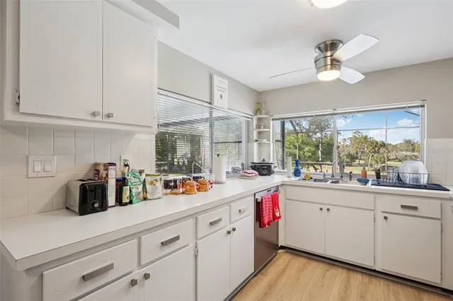 a bedroom with a bed and ceiling fan