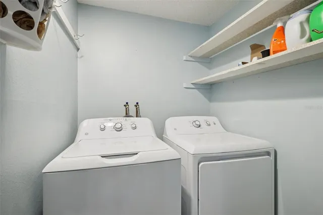 a view of a swimming pool with a patio