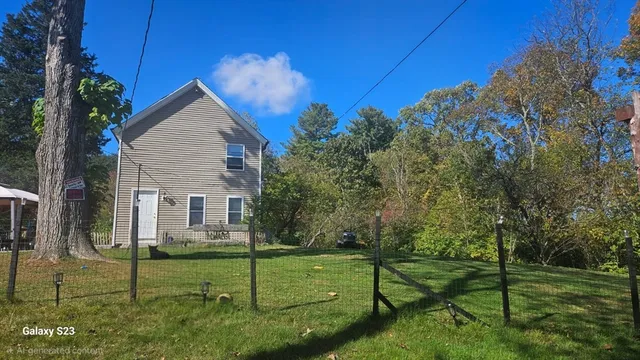 a view of a house with backyard