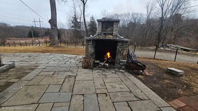 a view of a patio with table and chairs with barbeque and wooden fence