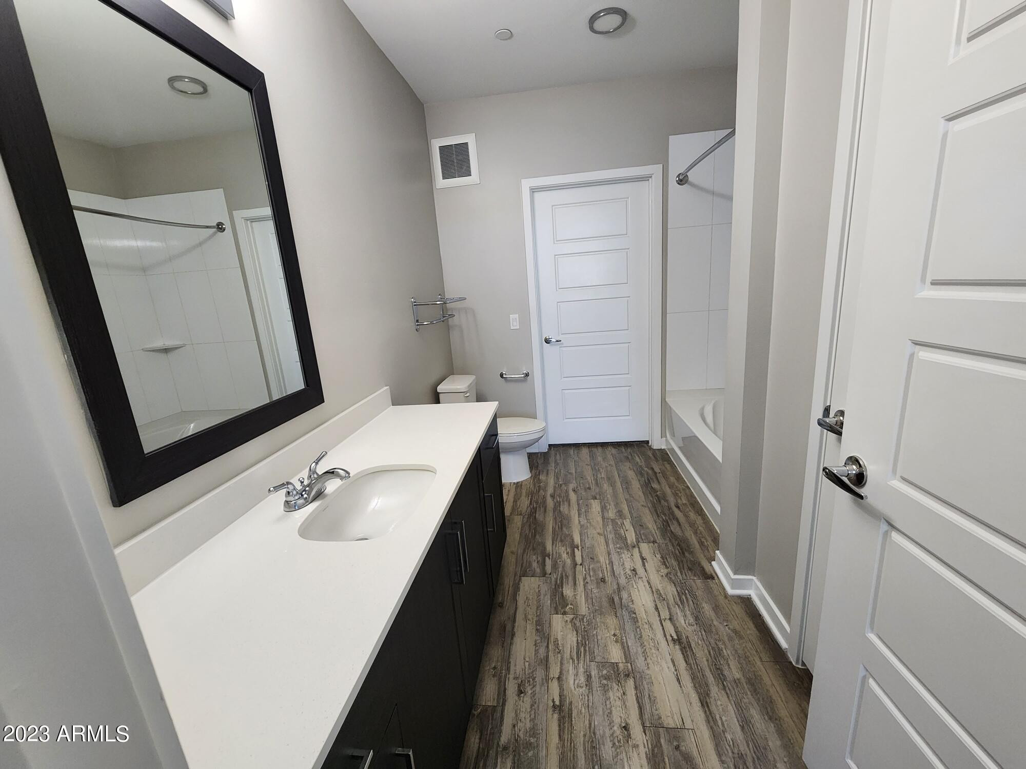 200 East Thomas Road, Unit B2 Phoenix, AZ 85012 - Photo 6 of 29 a bathroom with a sink and a mirror