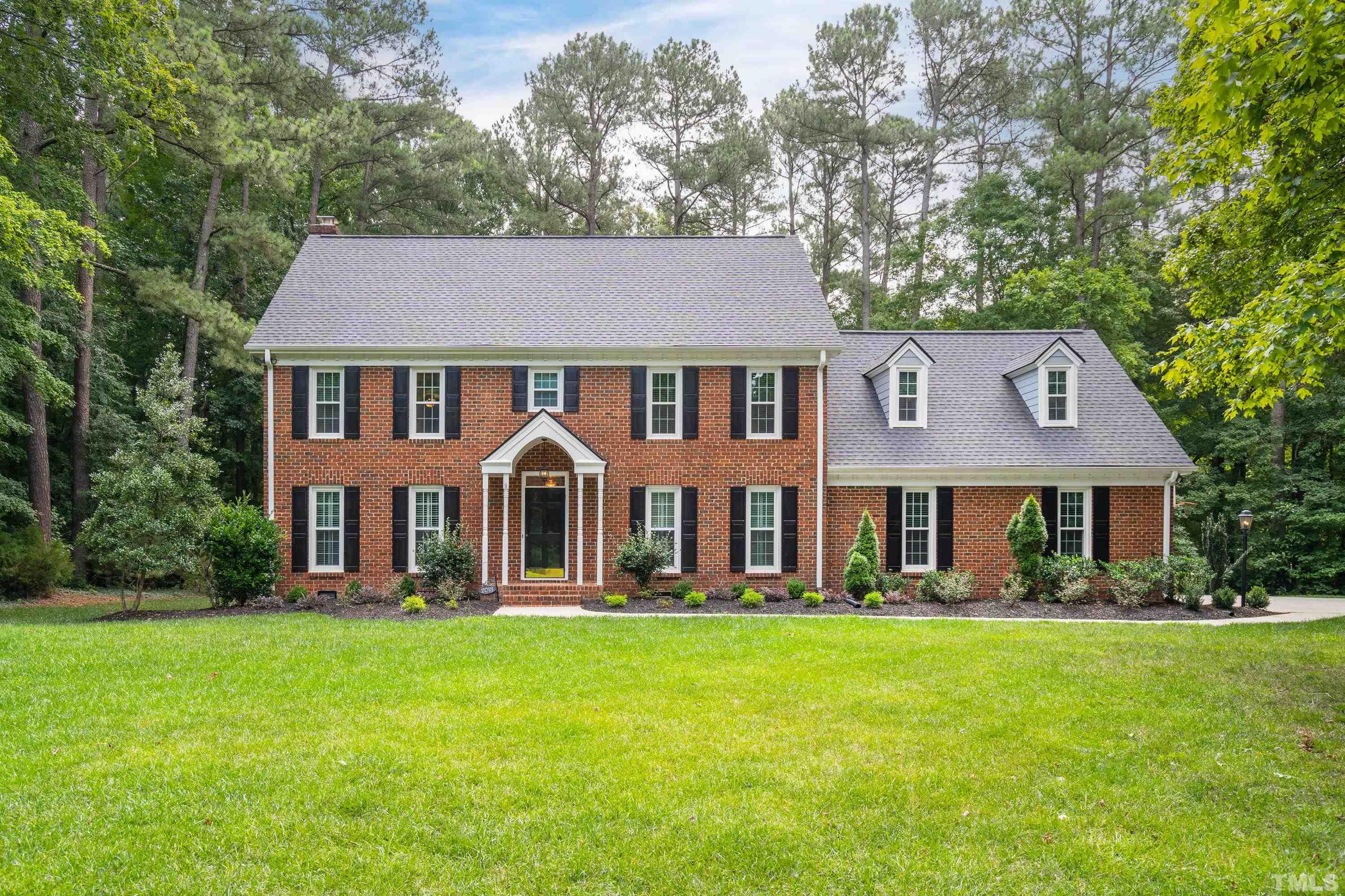 2013 Countrywood Road North Raleigh, NC 27615 - Photo 1 of 73 a front view of a house with a yard