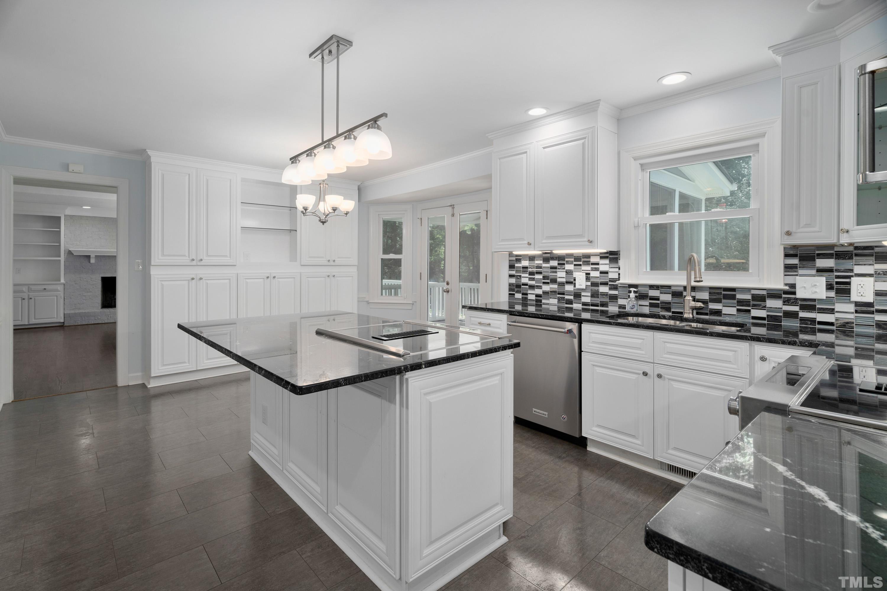 2013 Countrywood Road North Raleigh, NC 27615 - Photo 19 of 73 a kitchen with stainless steel appliances granite countertop a sink a stove and a wooden floors