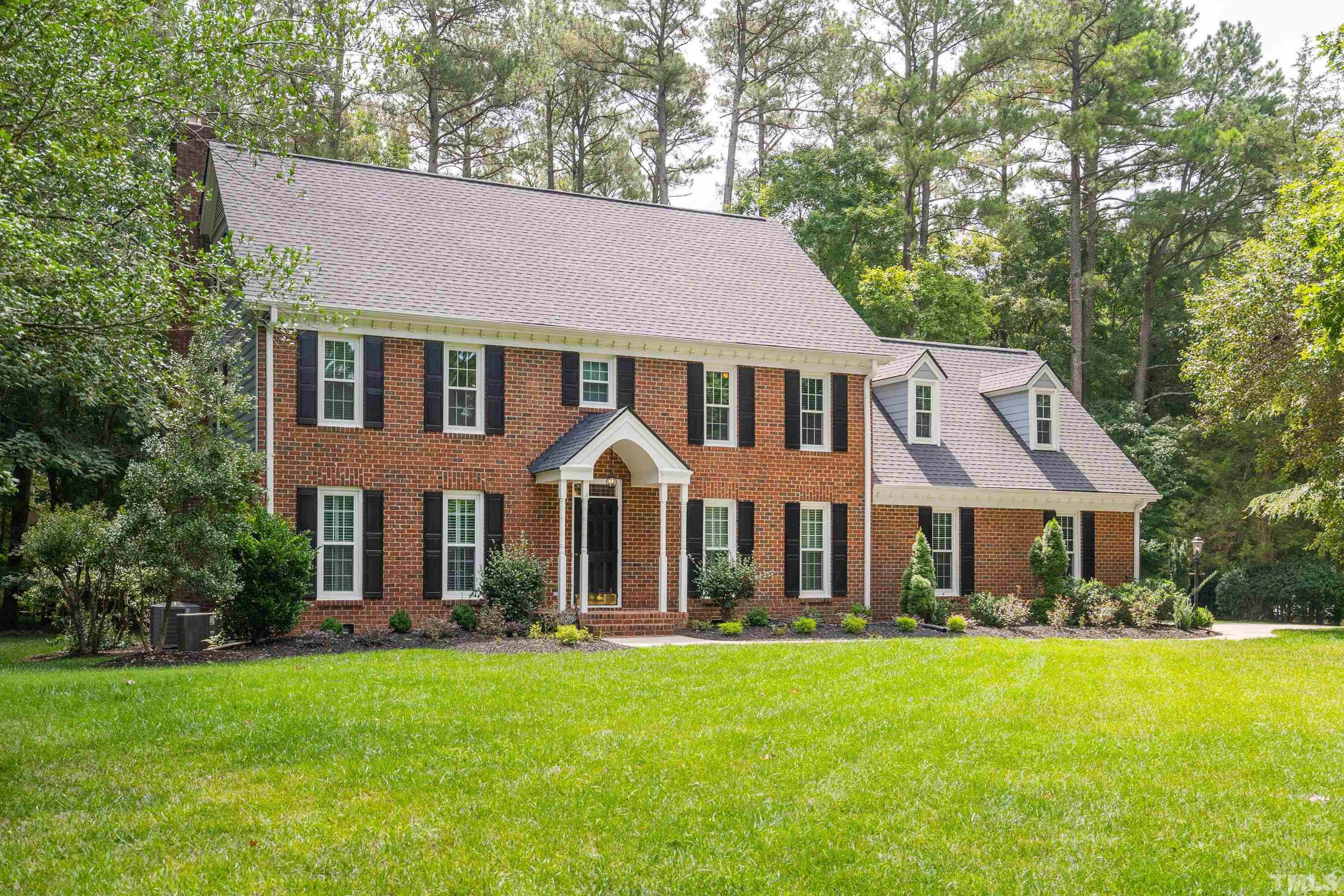 2013 Countrywood Road North Raleigh, NC 27615 - Photo 2 of 73 a front view of a house with a yard