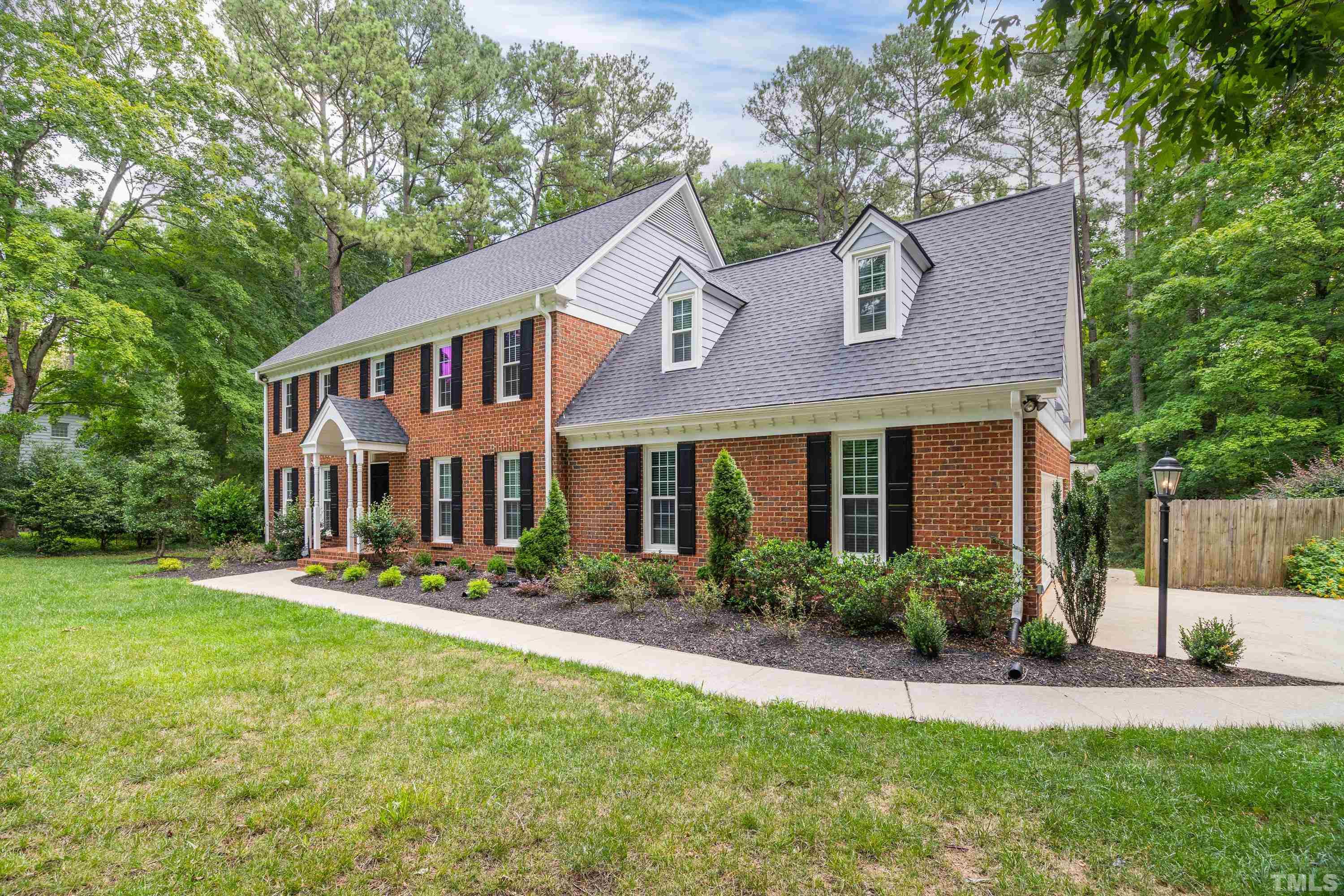 2013 Countrywood Road North Raleigh, NC 27615 - Photo 3 of 73 a front view of a house with a yard