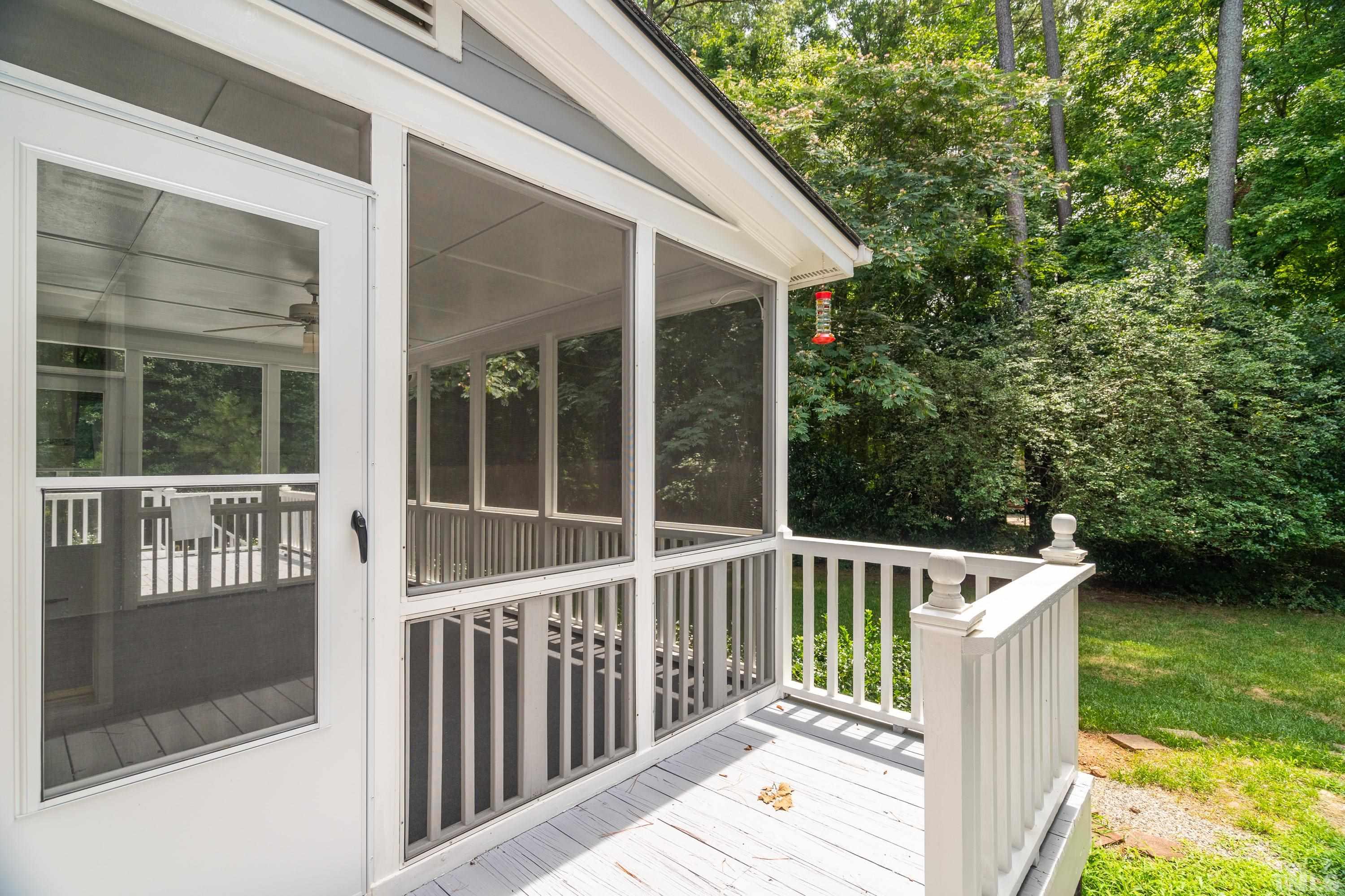 2013 Countrywood Road North Raleigh, NC 27615 - Photo 44 of 73 a view of a wooden deck and a yard with large trees
