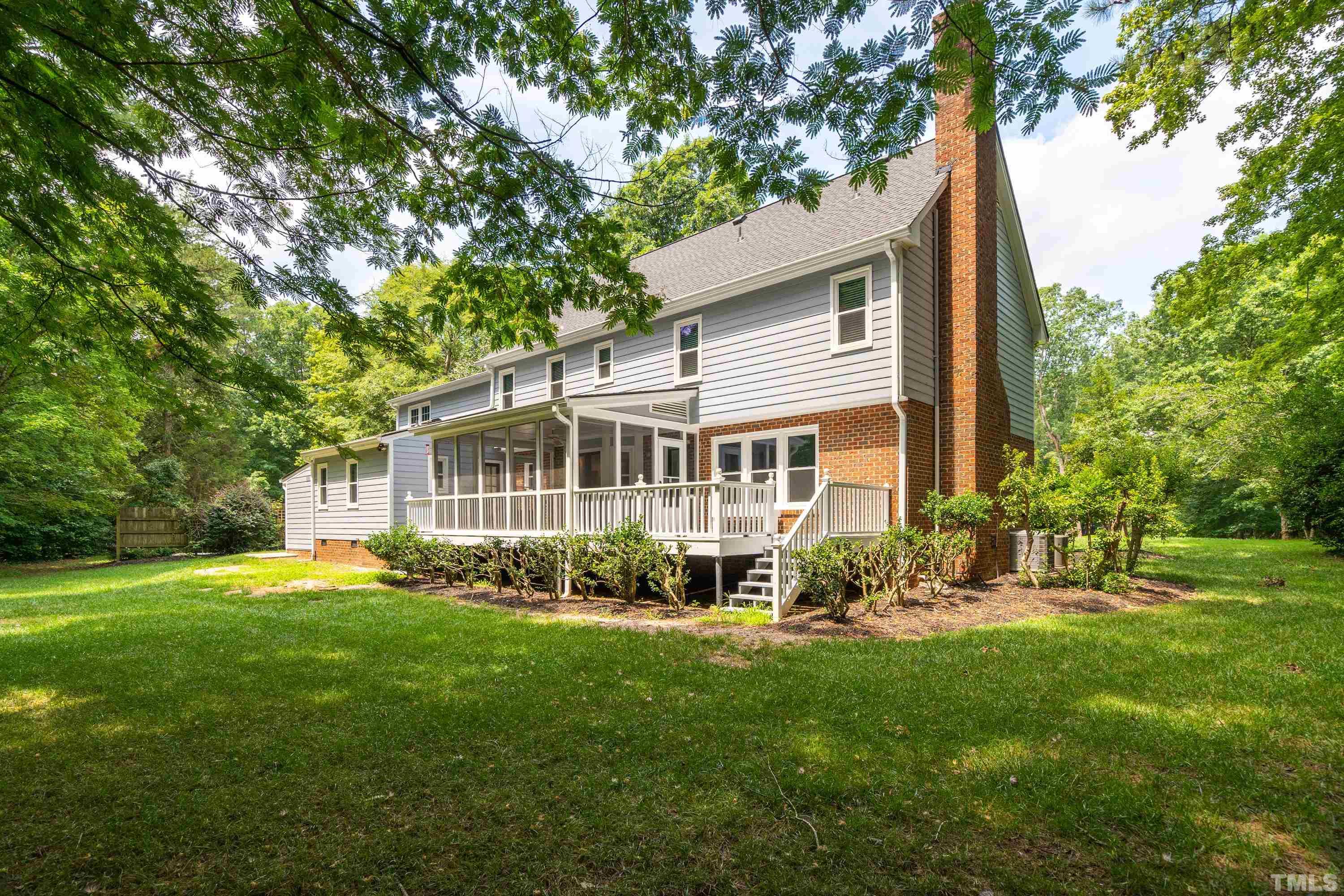 2013 Countrywood Road North Raleigh, NC 27615 - Photo 48 of 73 a front view of a house with a garden