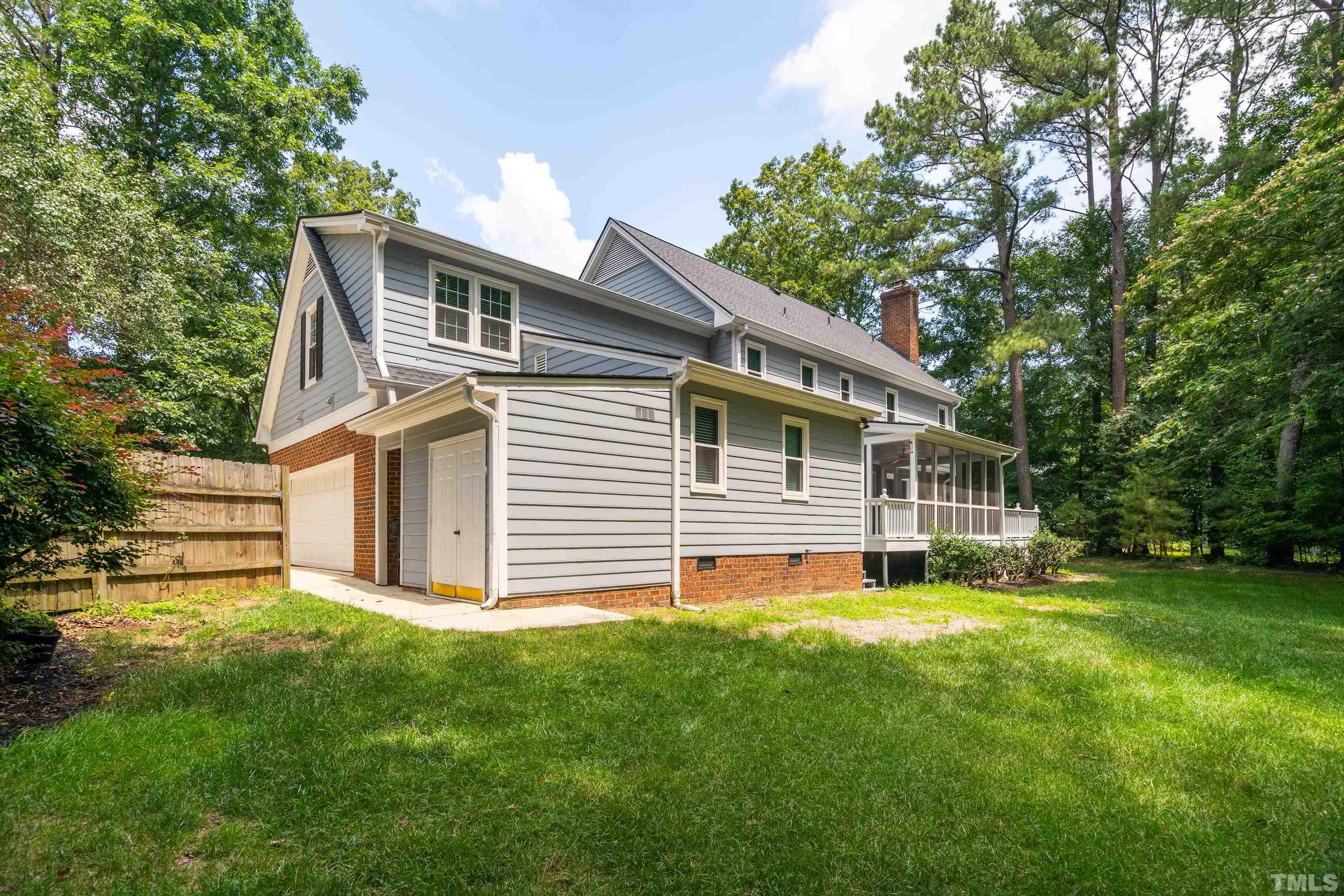 2013 Countrywood Road North Raleigh, NC 27615 - Photo 51 of 73 a front view of house with yard and green space