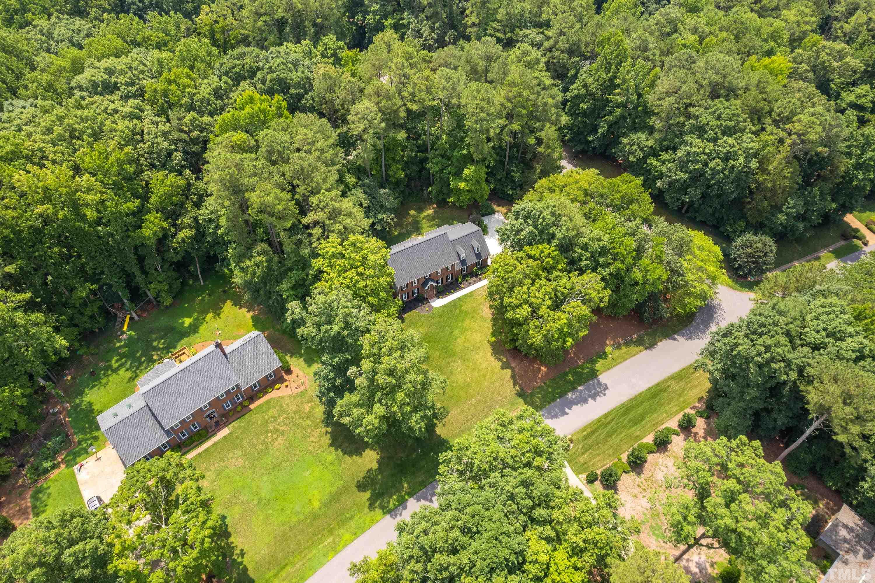 2013 Countrywood Road North Raleigh, NC 27615 - Photo 60 of 73 an aerial view of residential house with outdoor space and trees all around