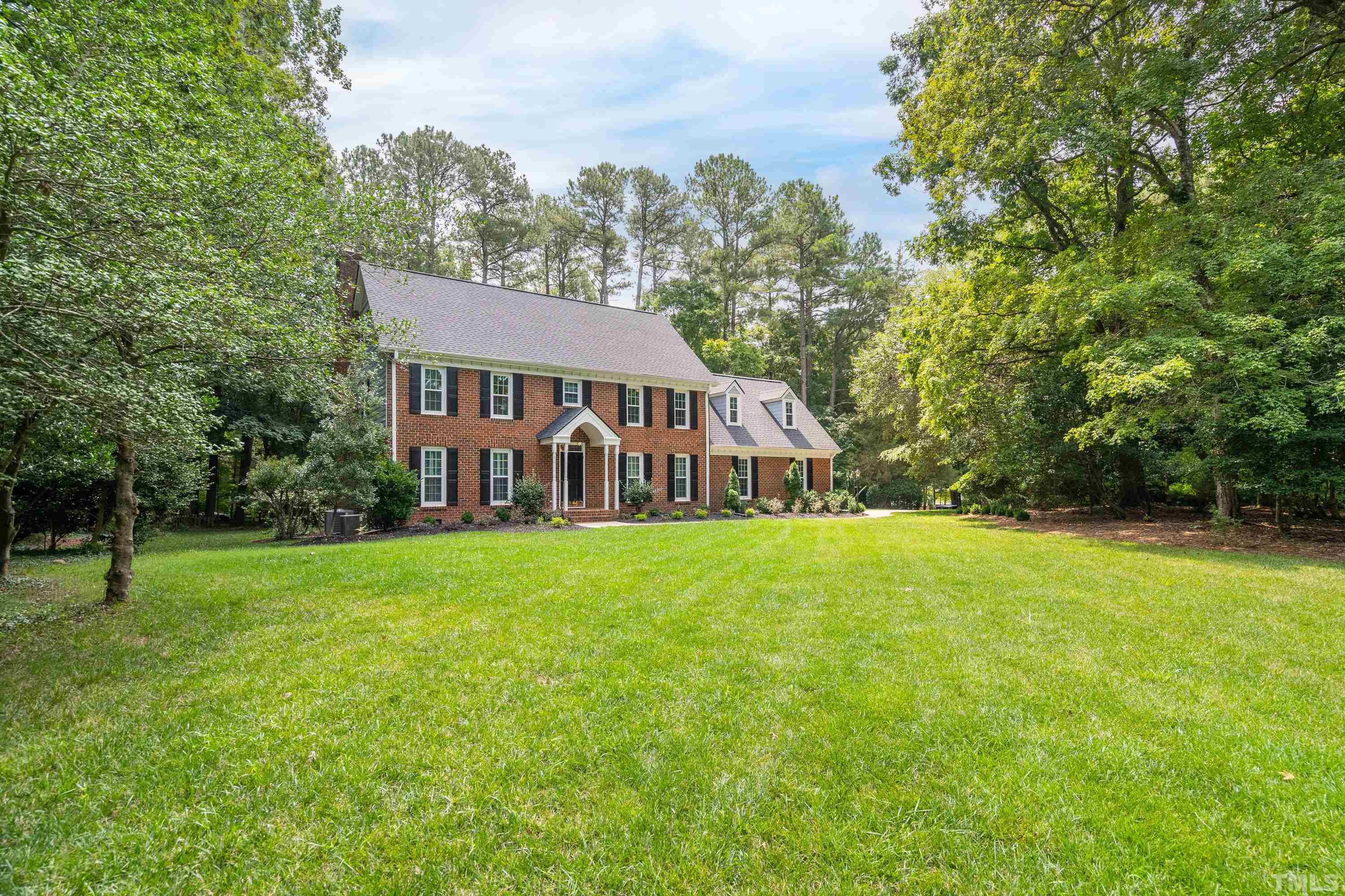 2013 Countrywood Road North Raleigh, NC 27615 - Photo 6 of 73 a view of a house with backyard and garden