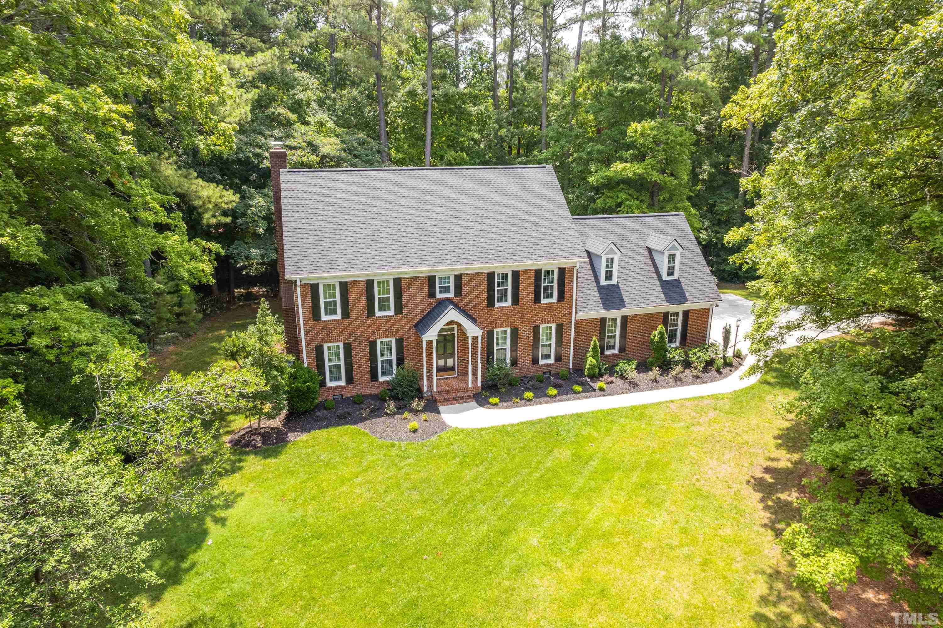 2013 Countrywood Road North Raleigh, NC 27615 - Photo 64 of 73 a front view of a house with yard and green space
