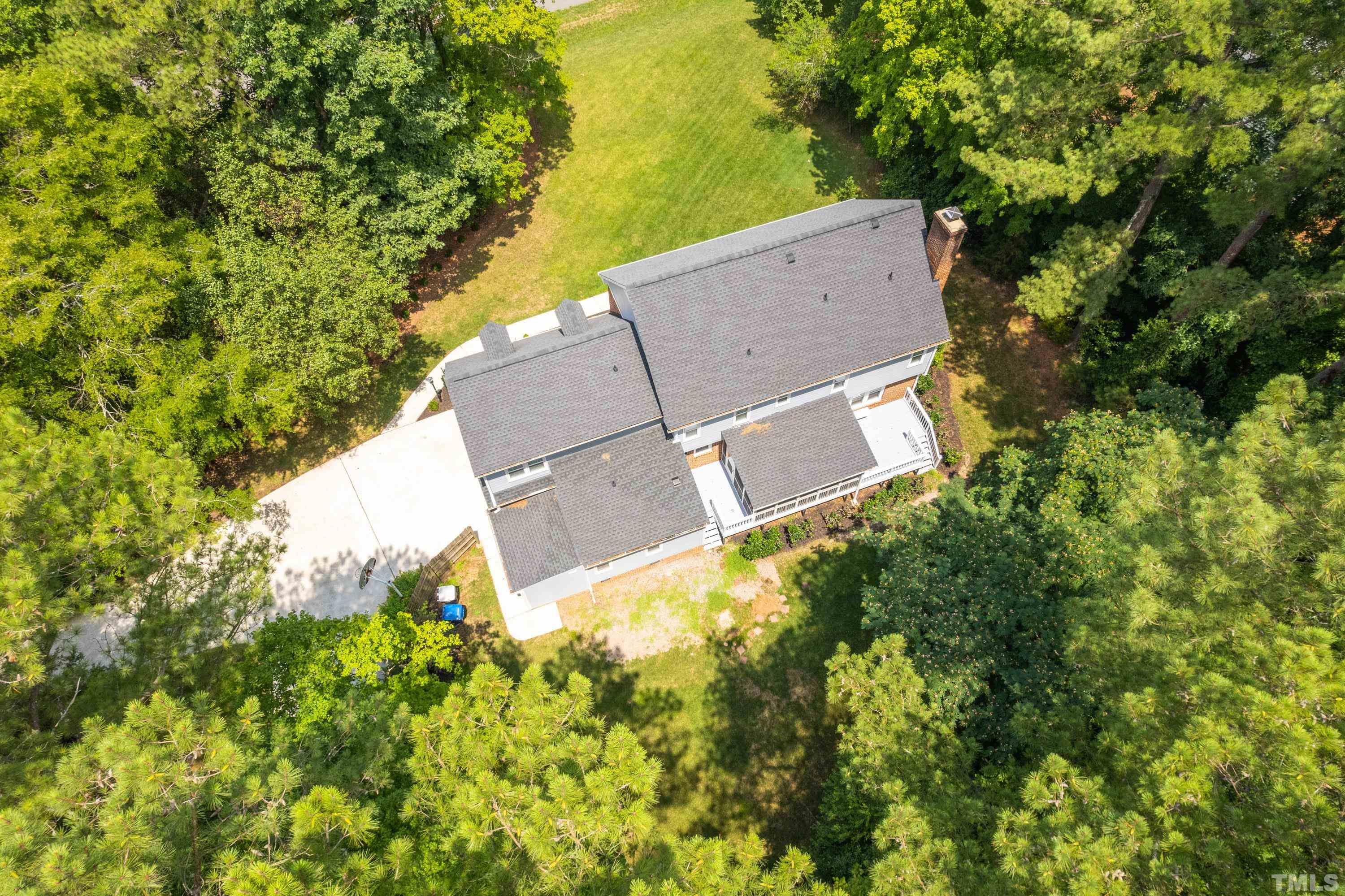 2013 Countrywood Road North Raleigh, NC 27615 - Photo 71 of 73 an aerial view of a house with a yard and large trees