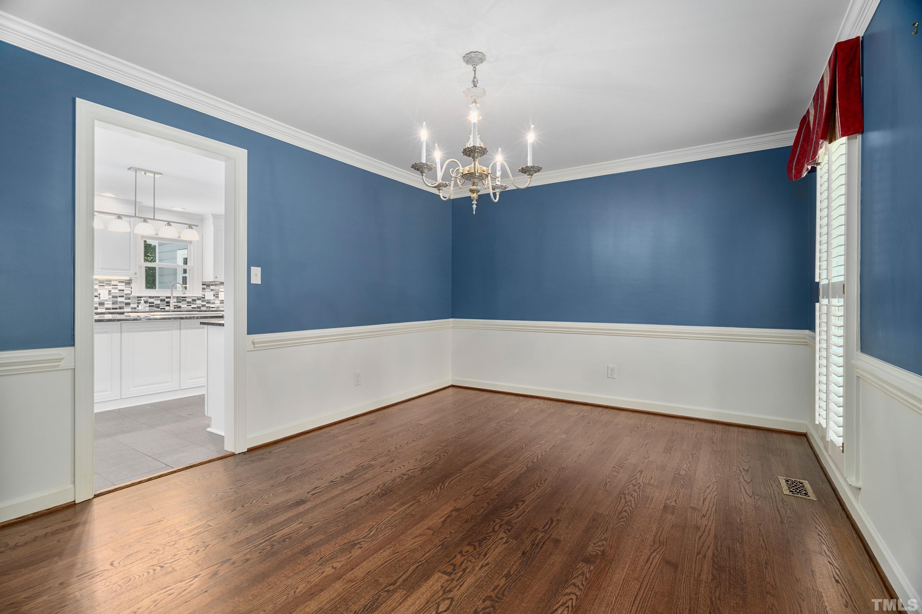 2013 Countrywood Road North Raleigh, NC 27615 - Photo 10 of 73 a view of an empty room with wooden floor and a window