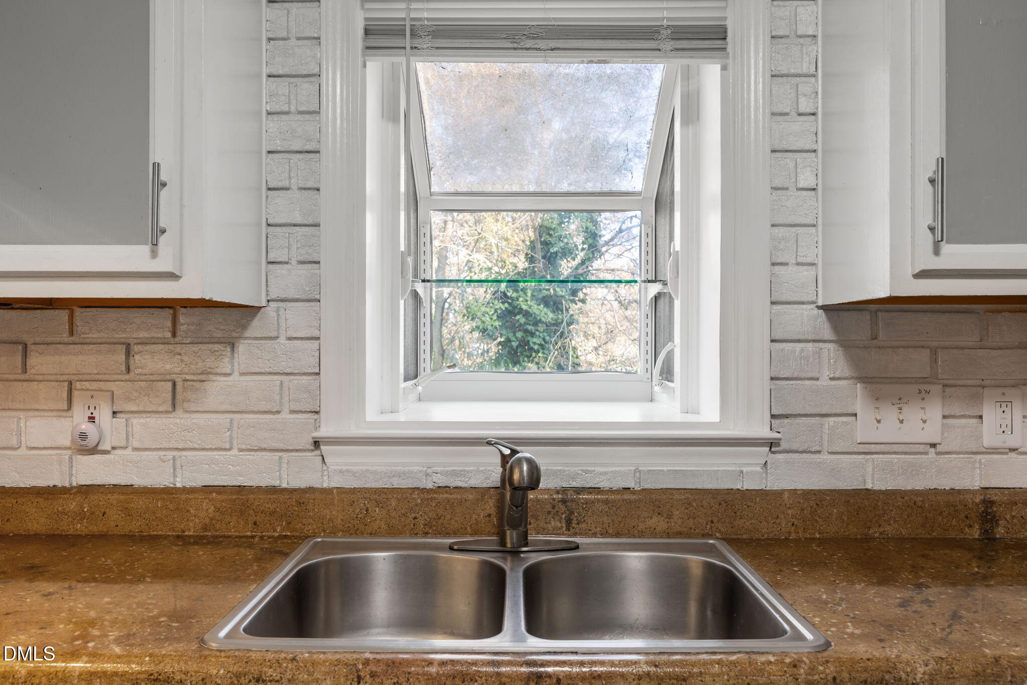 4700 Tolley Court Raleigh, NC 27616 - Photo 17 of 37 a kitchen with a sink and a window